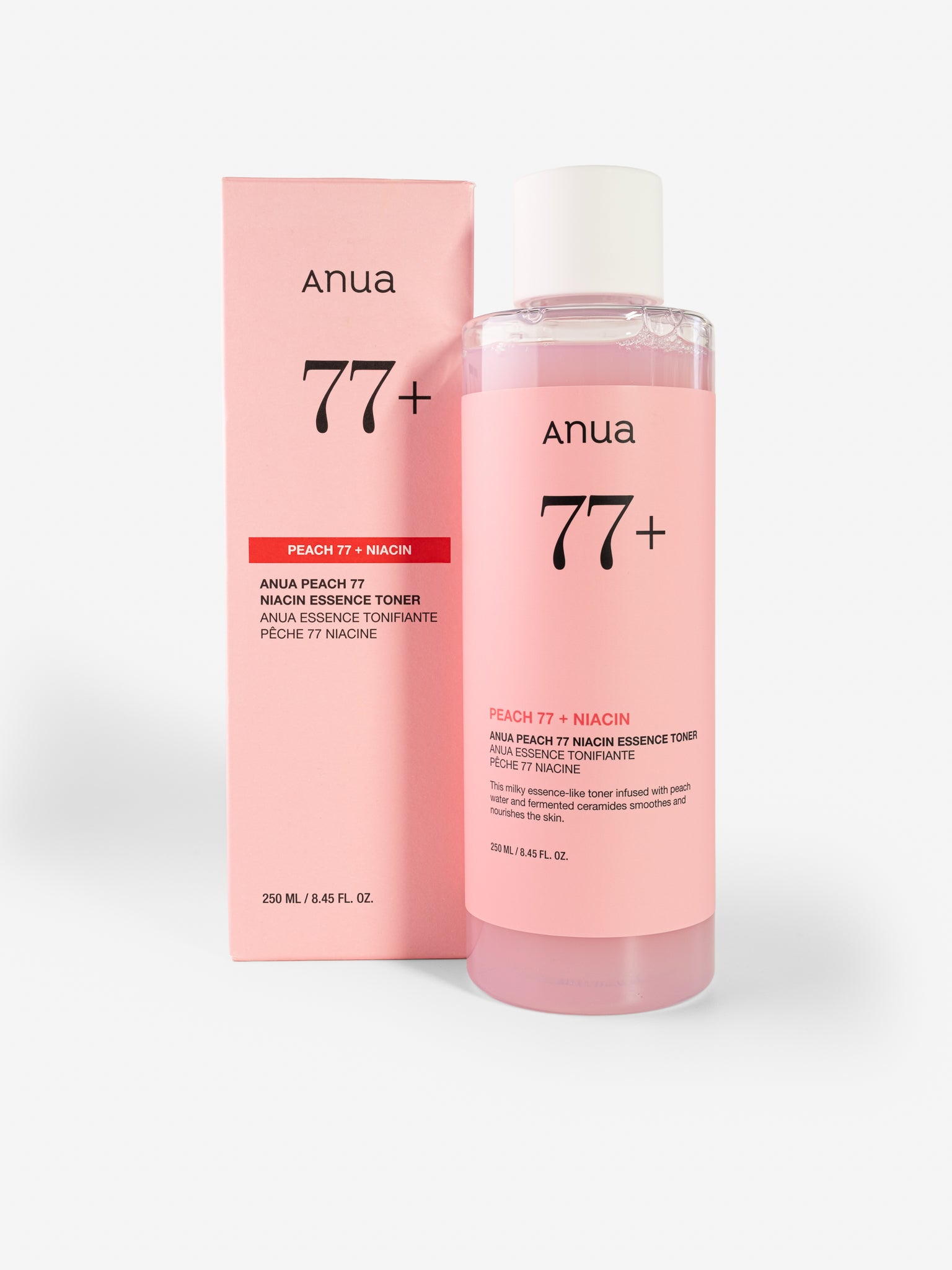 Anua 77+ Peach niacin with pink packaging on a white background