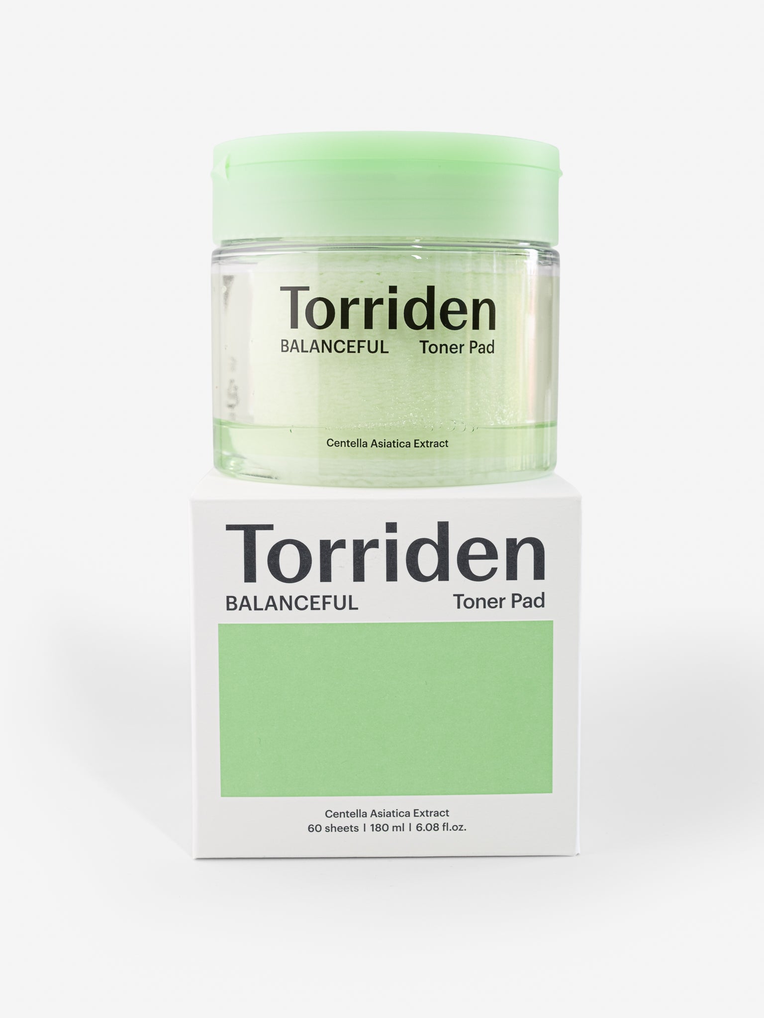 Torriden Balanceful Toner Pad on top of packaging on a white background