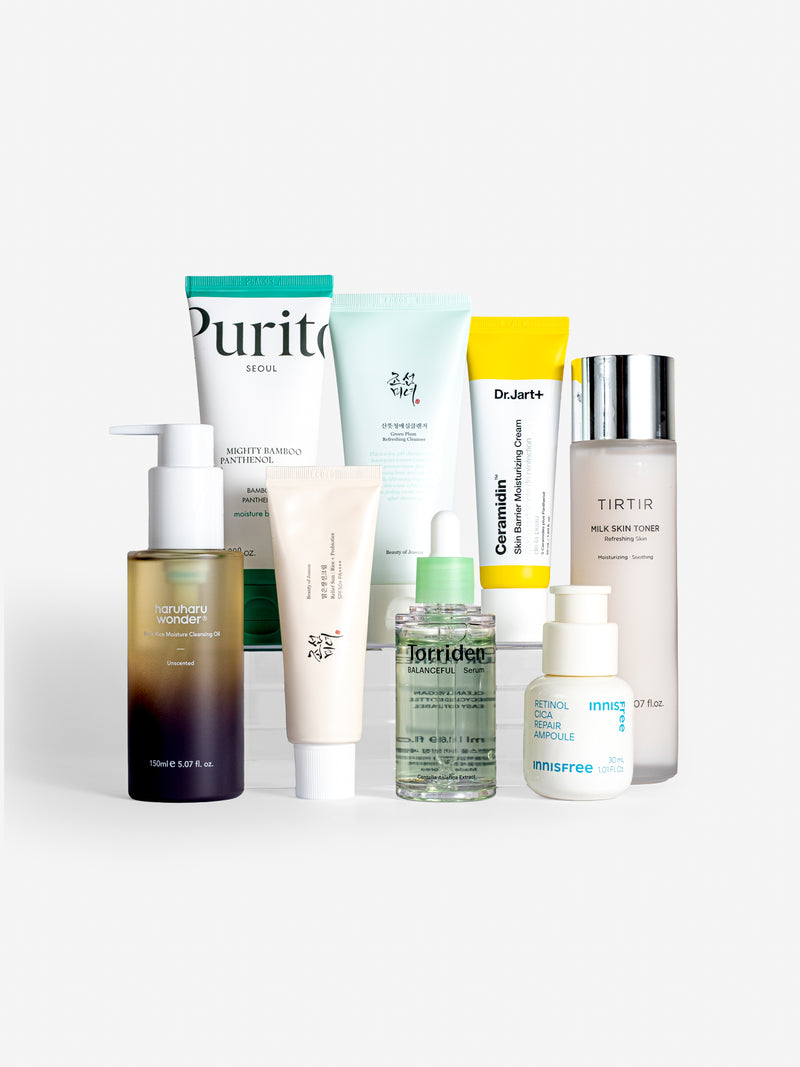 Skincare bundle containing purito seoul mighty bamboo panthenol cream, beauty of joseon green plum refreshing cleanser, dr jart ceramidin skin barrier moisturizing cream, tirtir milk skin toner, haruharu wonder black rice moisture cleansing oil, Beauty of joseon relief sun: rice + probiotics, torriden balanceful serum and innisfree retinol cica repair ampoule on white background