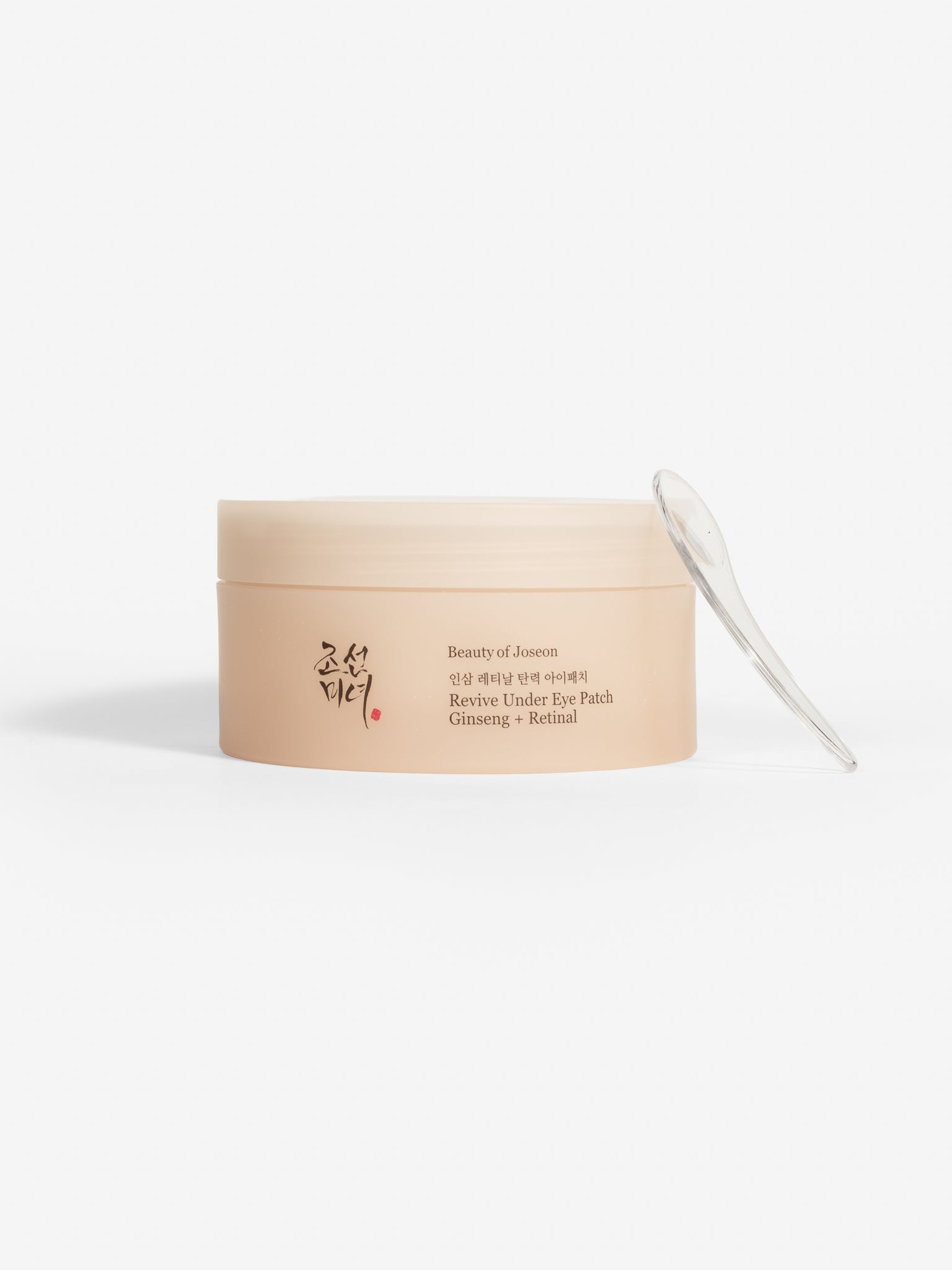 Beauty of Joseon Revive Under Eye Patch (Ginseng + Retinal) jar with a clear applicator spatula.
