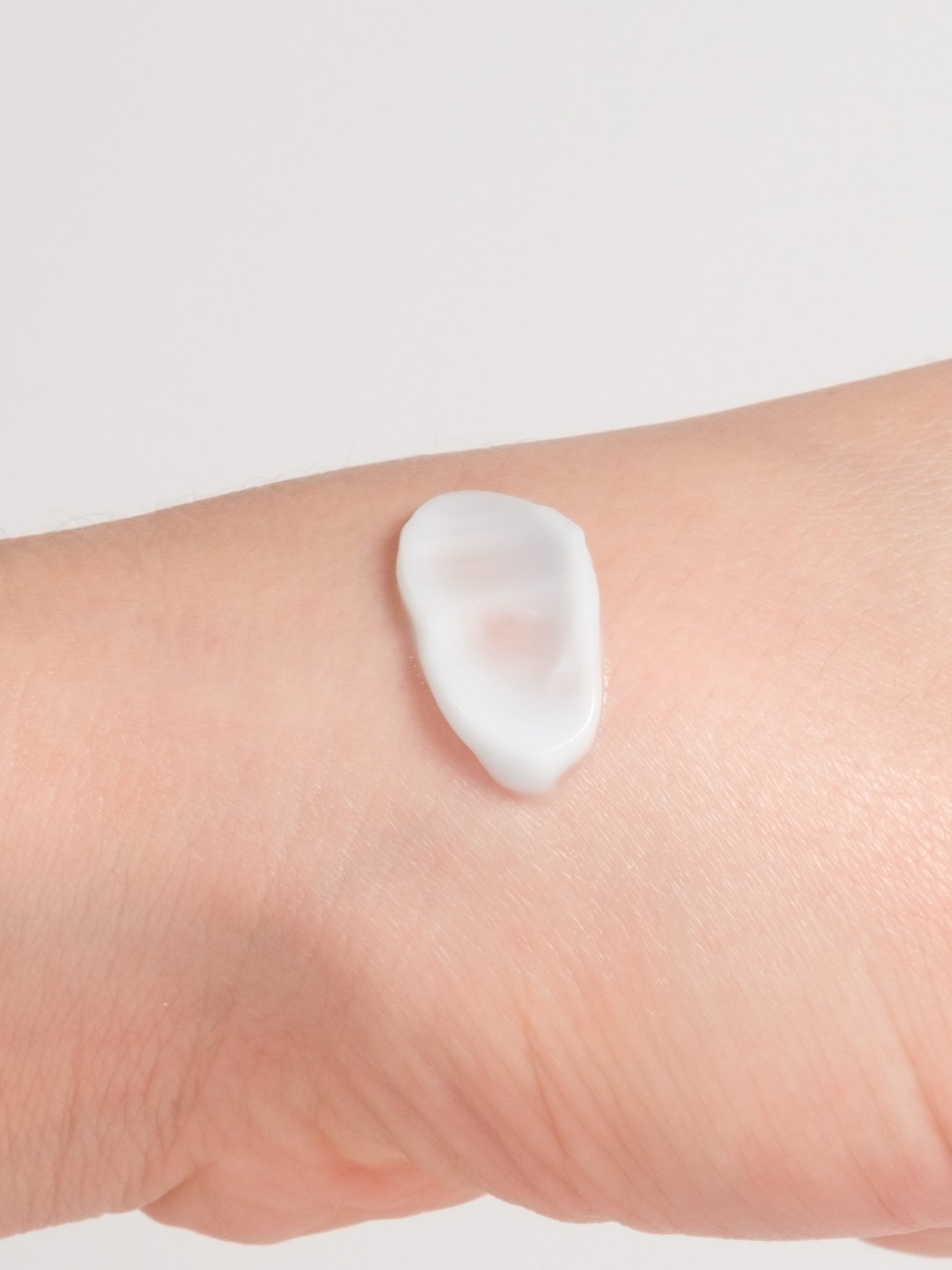 Close-up of Dr. Althea 147 Barrier Cream texture, a rich pale-blue ceramide moisturiser