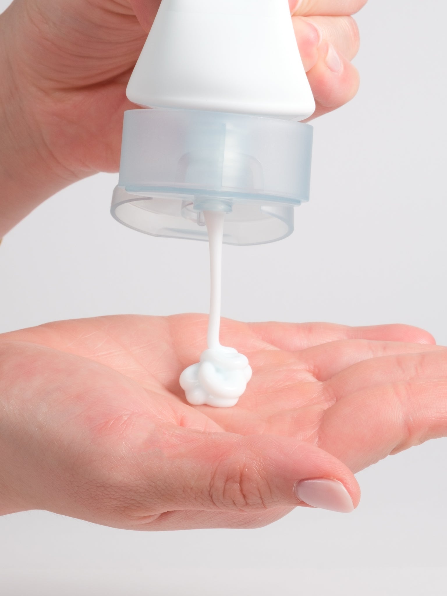 SKIN1004 Hyalu-Cica Moisture Cream being dispensed as a light cream into a palm