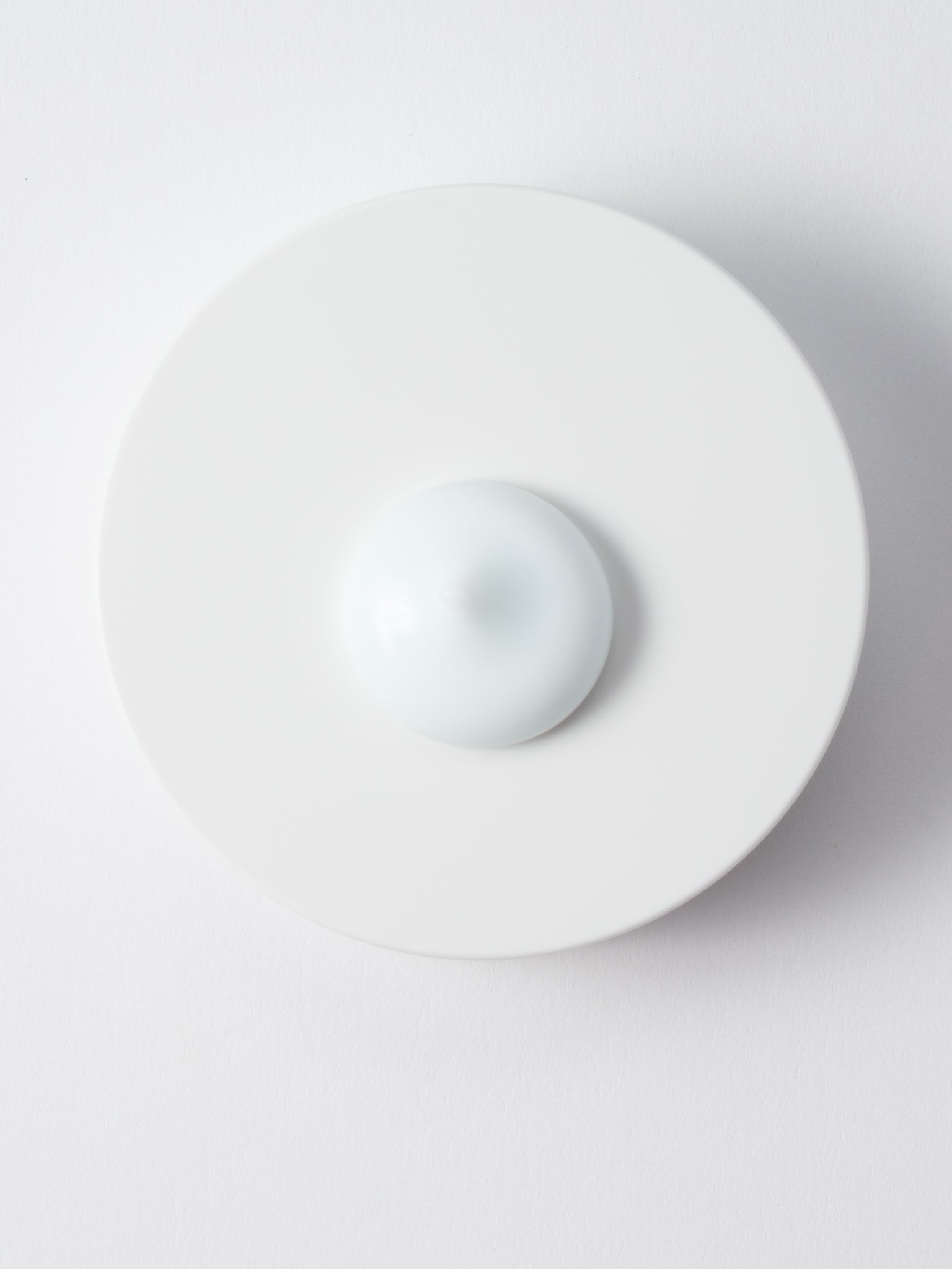 Pale blue-white gel-cream texture of SKIN1004 Hyalu-Cica Moisture Cream on a white dish