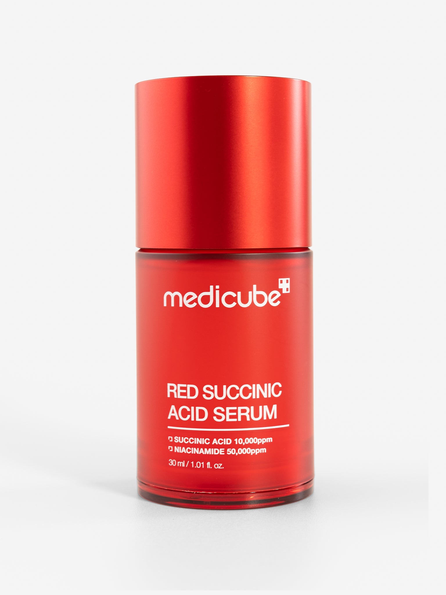 Medicube red succinic acid serum bottle on a white background