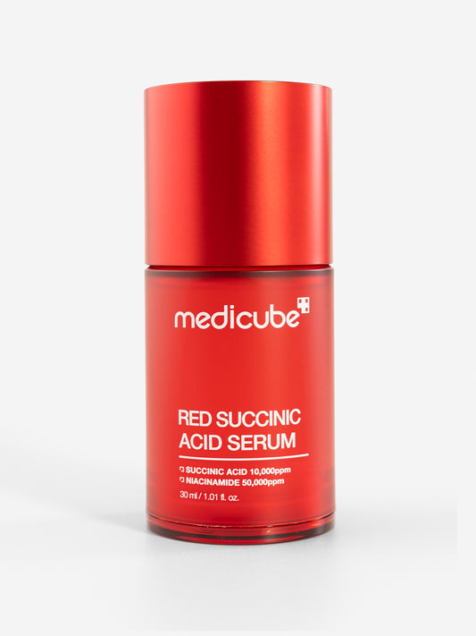 Medicube red succinic acid serum bottle on a white background