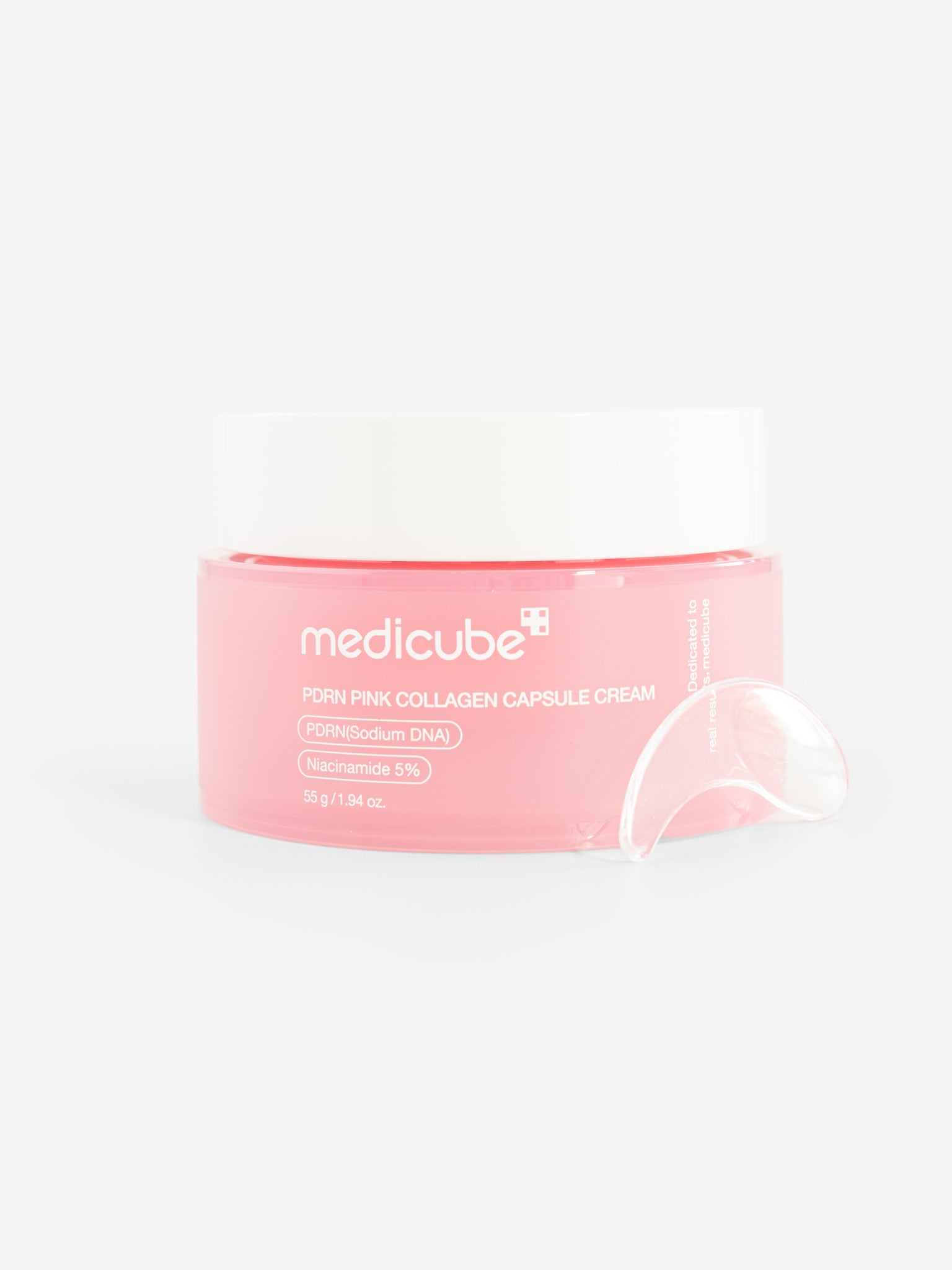 Medicube PDRN pink collagen capsule cream with applicator on a white background