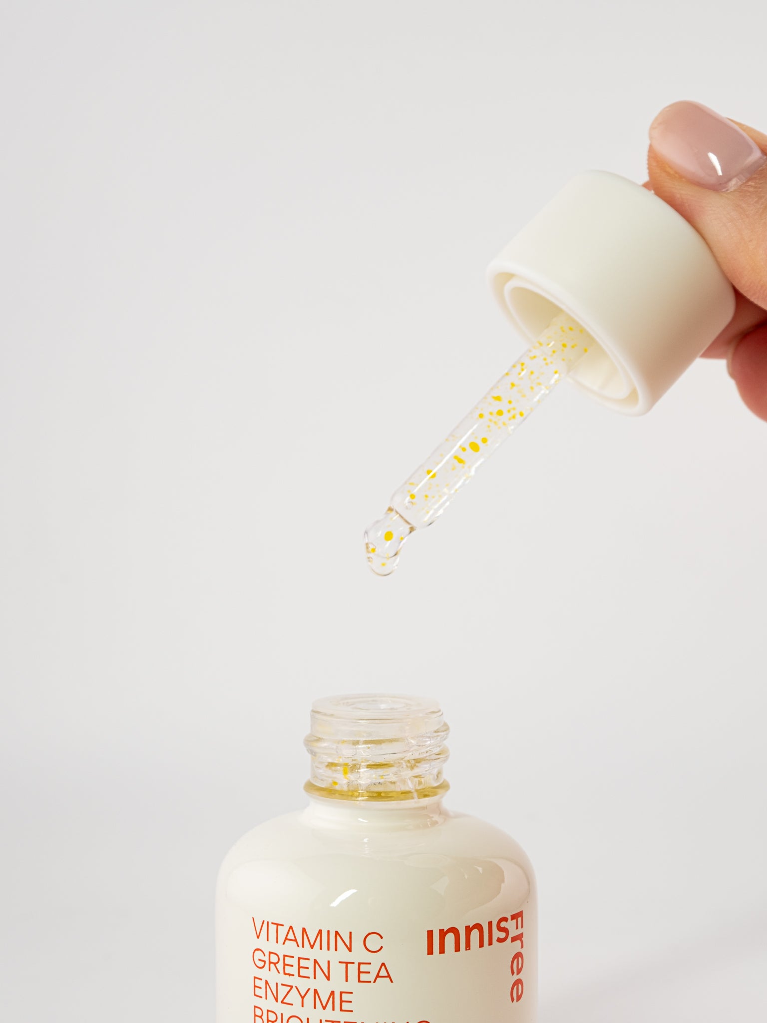 Innisfree vitamin c green tea enzyme 
with dropper on a white background