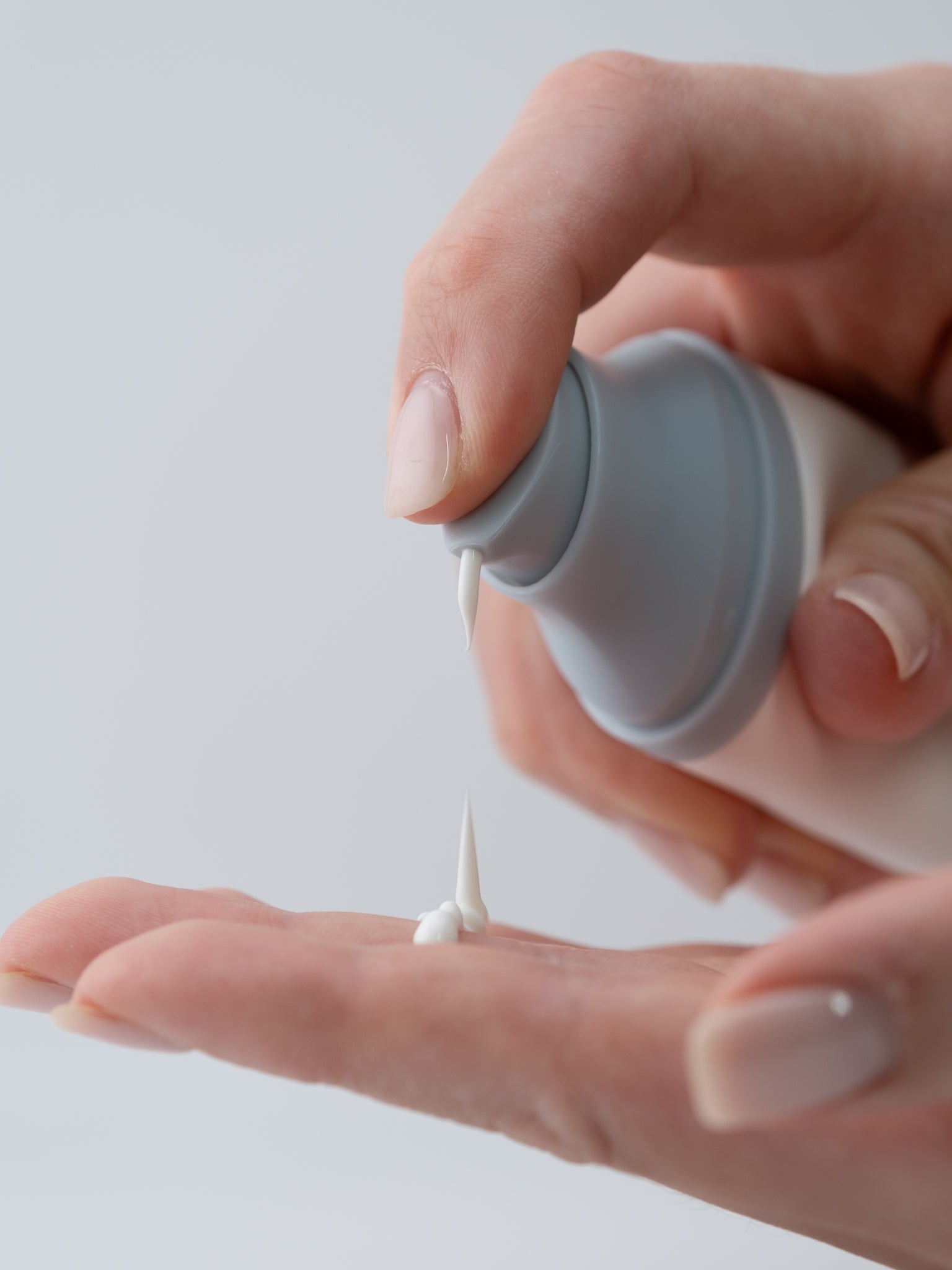 SKIN1004 Madagascar Centella Hyalu-Cica Water-Fit Sun Serum 50ml close up with serum on hand