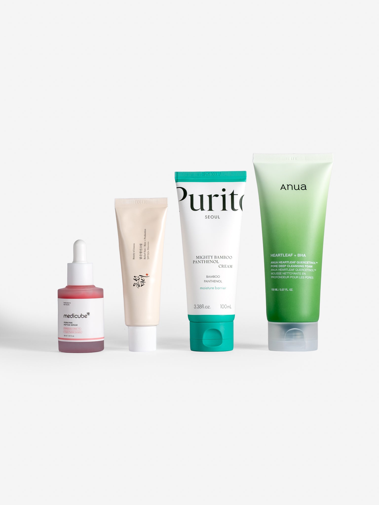 Medicube pdrn pink peptide serum, beauty of joseon relief sun rice + probiotics, mighty bamboo panthenol cream and anua heart quercetinol + pore deep cleansing foam on white background