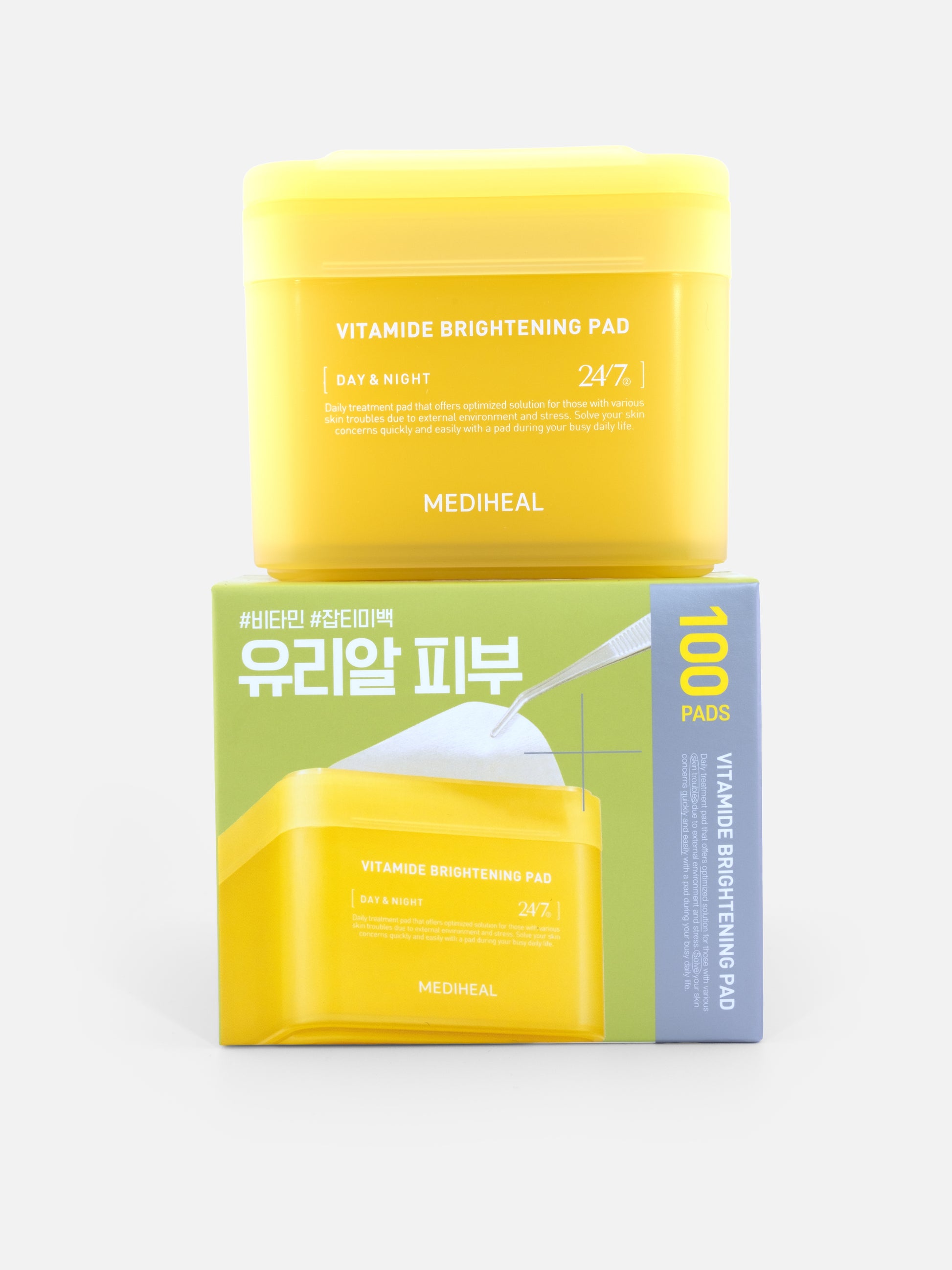 MEDIHEAL Vitamide Brightening Pad 100 pads on top of packaging on grey background